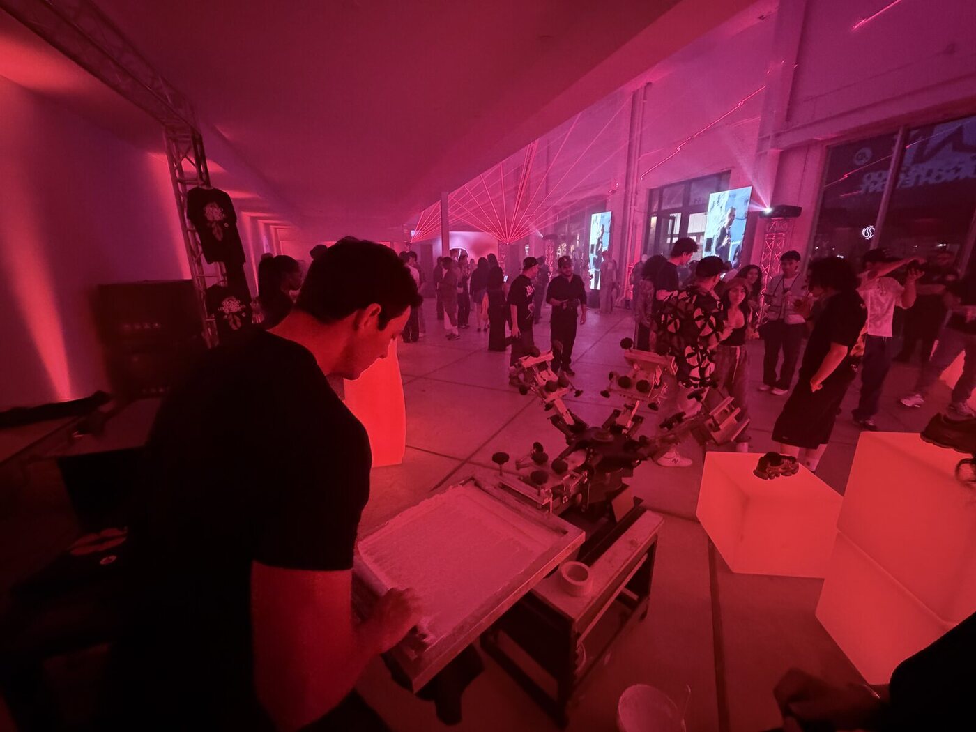 Crowd gathered around a live brand activation printing station